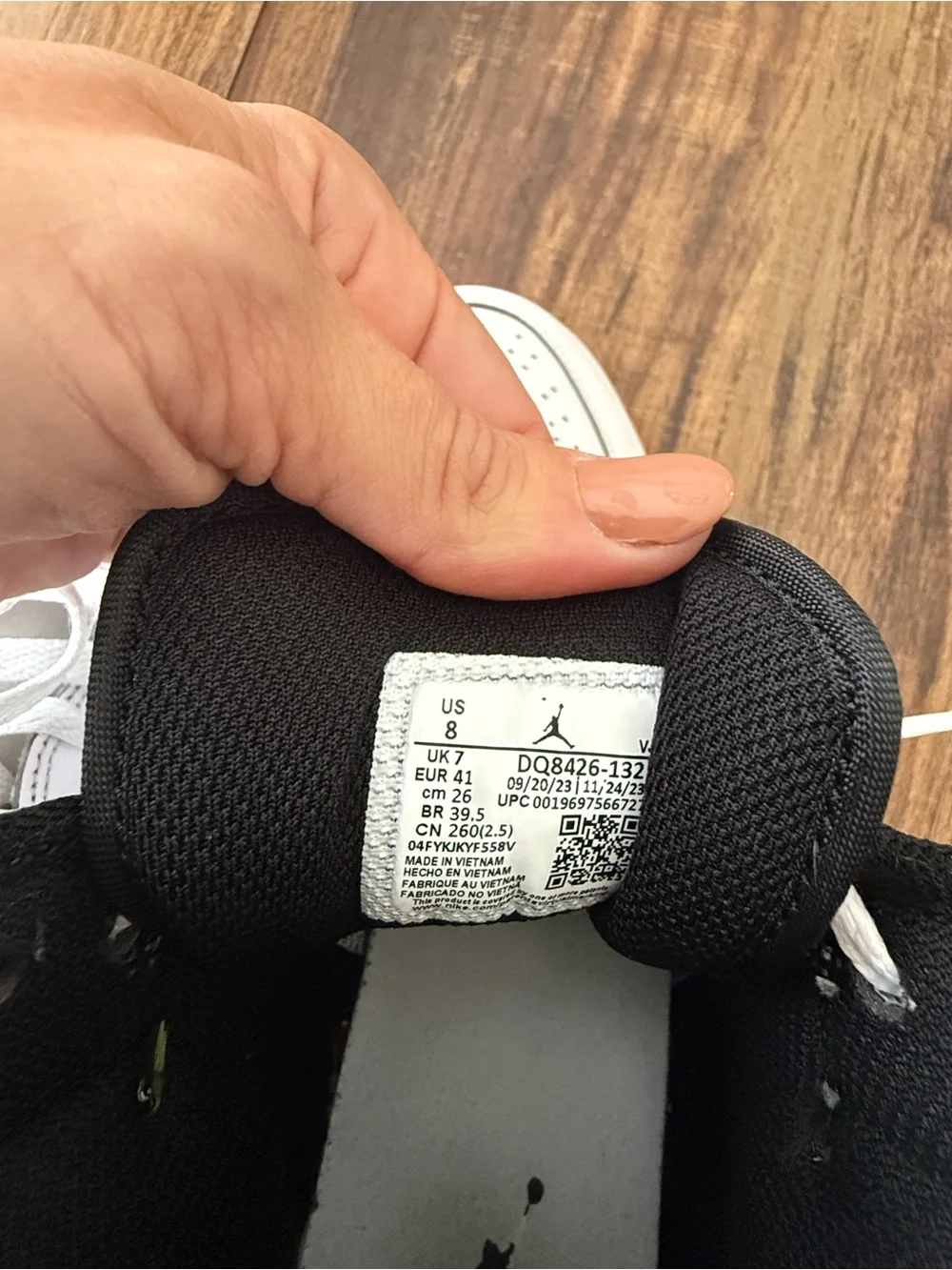 Nike Air Jordan 1 White and Black Mid-Top Sneakers